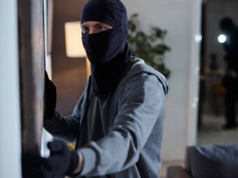 Criminal Wearing Mask Stealing Painting during Home Burglary Silberstreif am deutschen Konjunkturhorizont criminal wearing mask stealing painting home burglary Versicherungspapa
