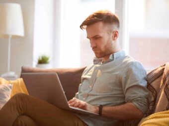 Handsome Man Using Laptop at Home Silberstreif am deutschen Konjunkturhorizont handsome man using laptop home scaled Versicherungspapa